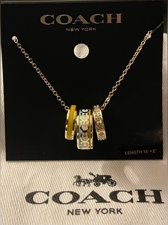 Coach Jewelry - Coach Gold-Tone Pendant Necklace with Yellow and White Accents
